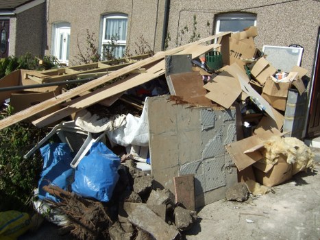 Various types of waste being sorted for clearance in Earls Court